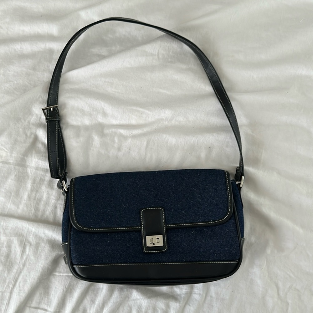 Dark denim blue women’s shoulder bag with front closure
